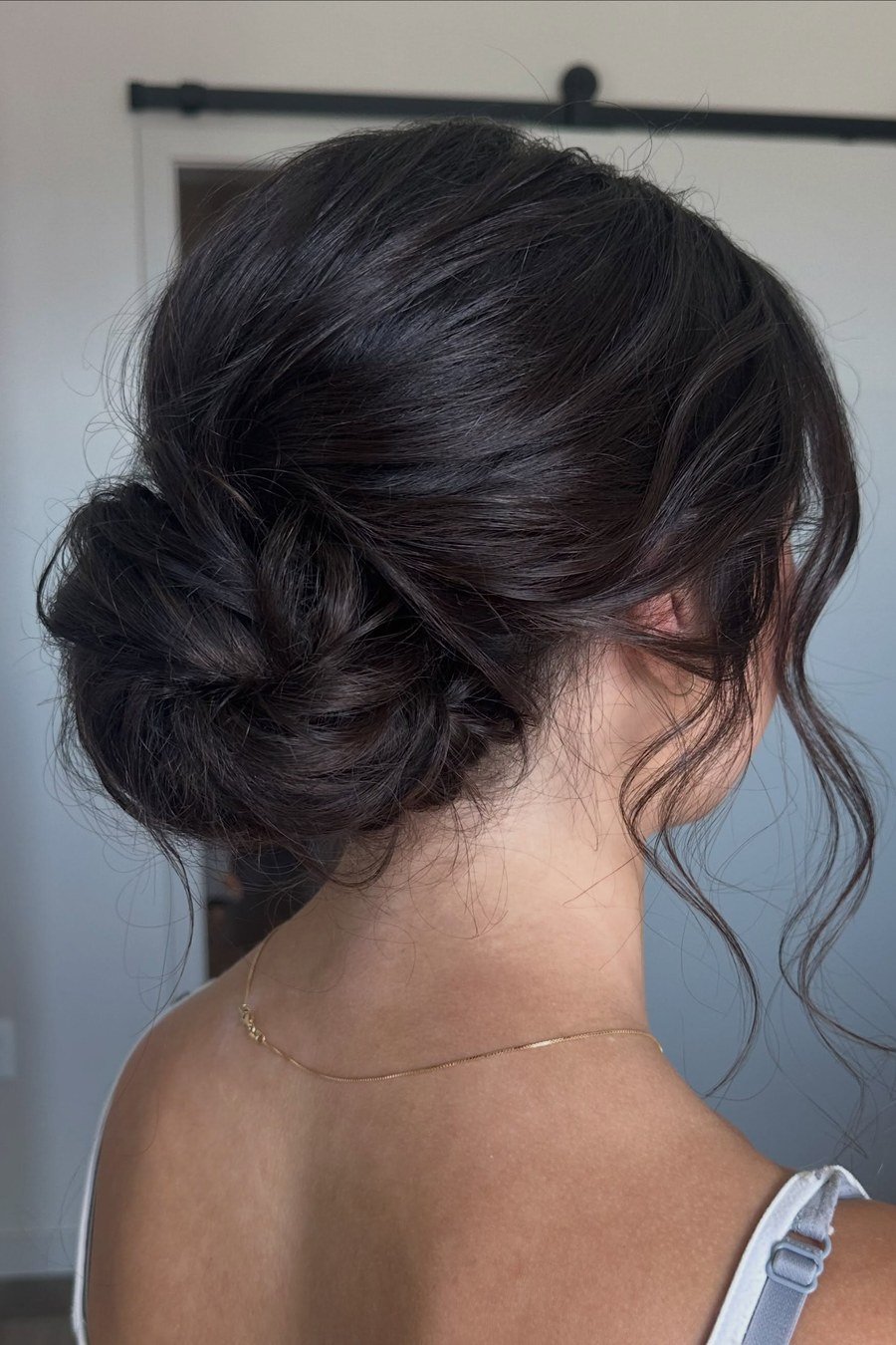 Romantic Low Bun with Tendrils bridesmaid hairstyle