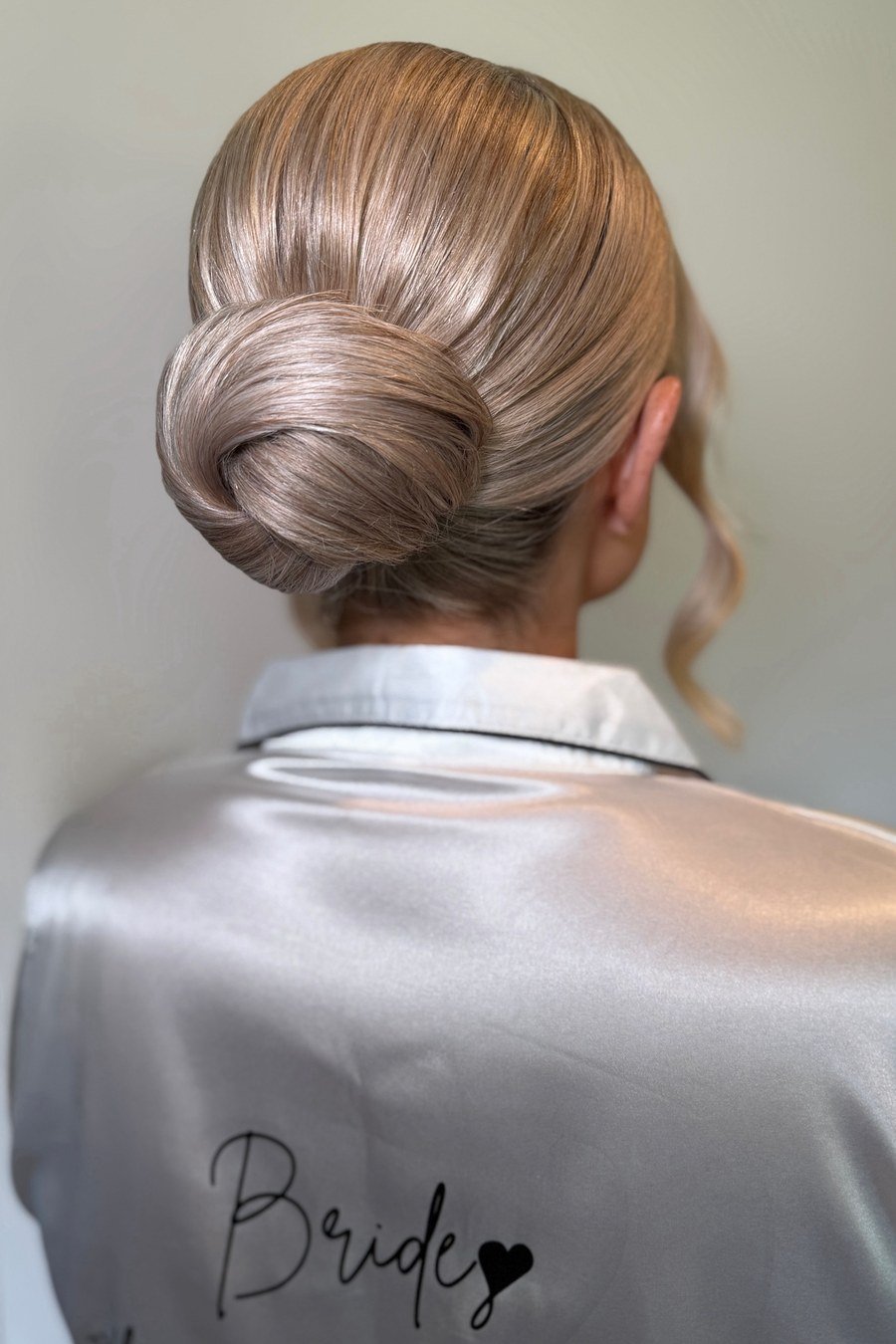 Sleek Low Bun — easy updo for wedding guest hairstyle