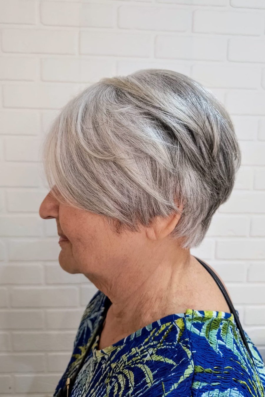 Cropped Pixie with Side-Swept Bangs - low maintenance short grey hairstyles for women