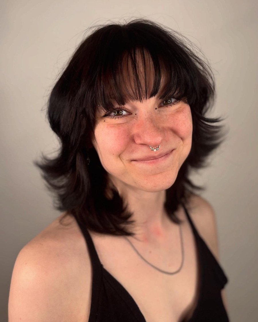 Client with shoulder-length textured shag and rounded fringe
