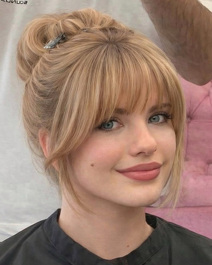 Curtain bangs framing the face, blonde