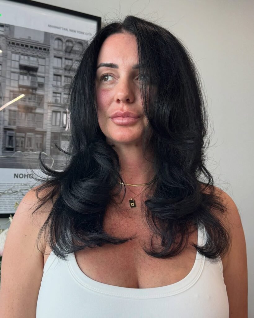 Polished blowout layers - long layered haircut for women over 50