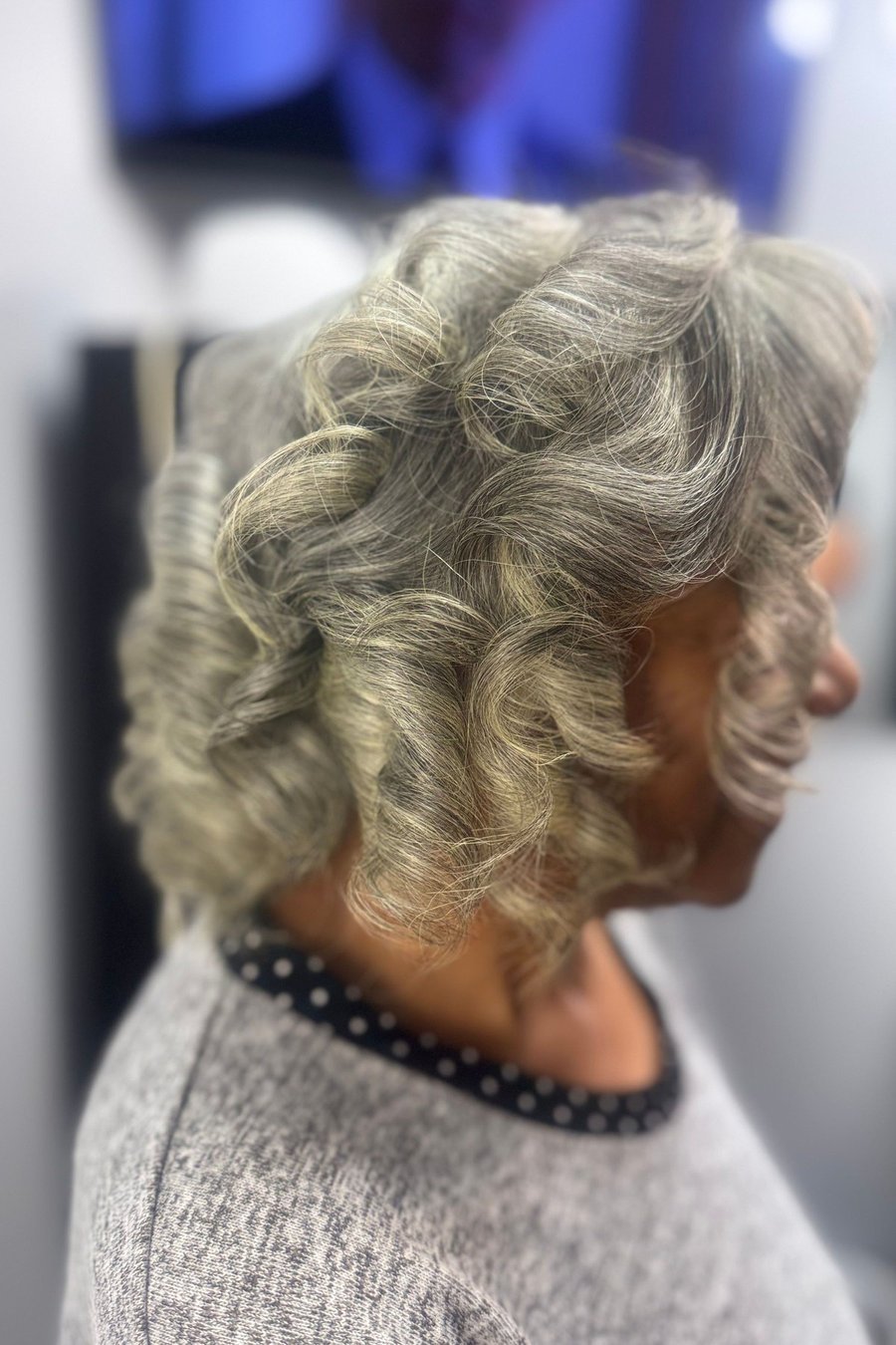 Curly Layered Mid-Length Cut medium length hairstyle for women over 70