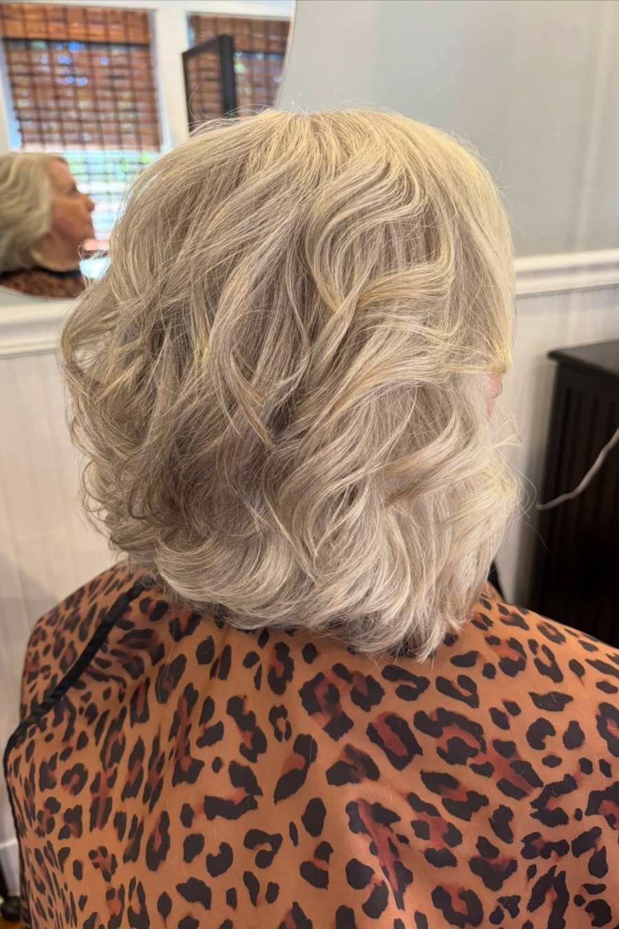 Medium-Length Feathered Layers medium length hairstyle for women over 70