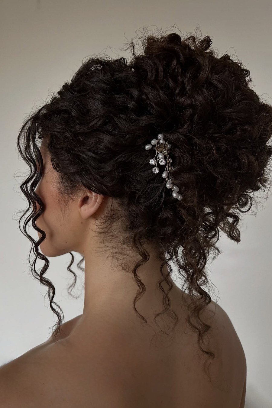 Textured High Bun - curly hairstyles