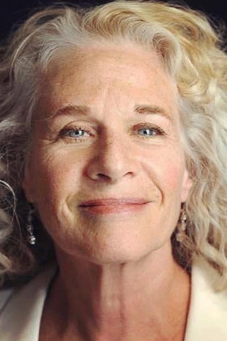 Voluminous Curly Lob medium length hairstyle for women over 70