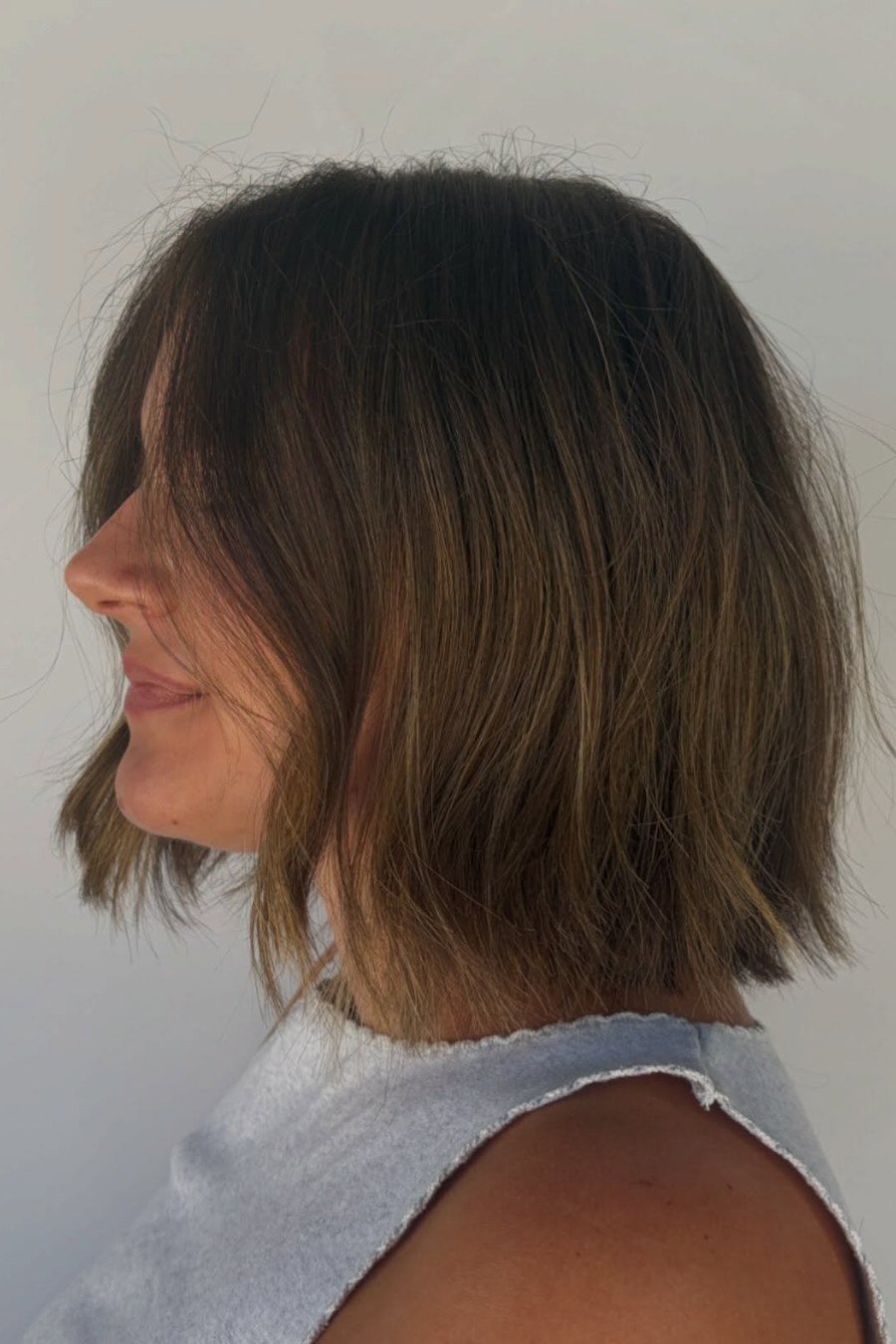 Choppy Layered Bob with Bangs mom haircut idea
