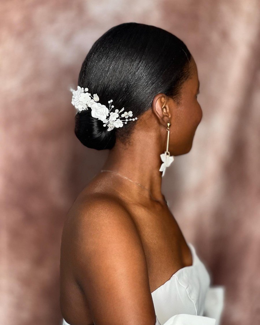Sleek Middle-Part Low Bun - fall hairstyles for black women