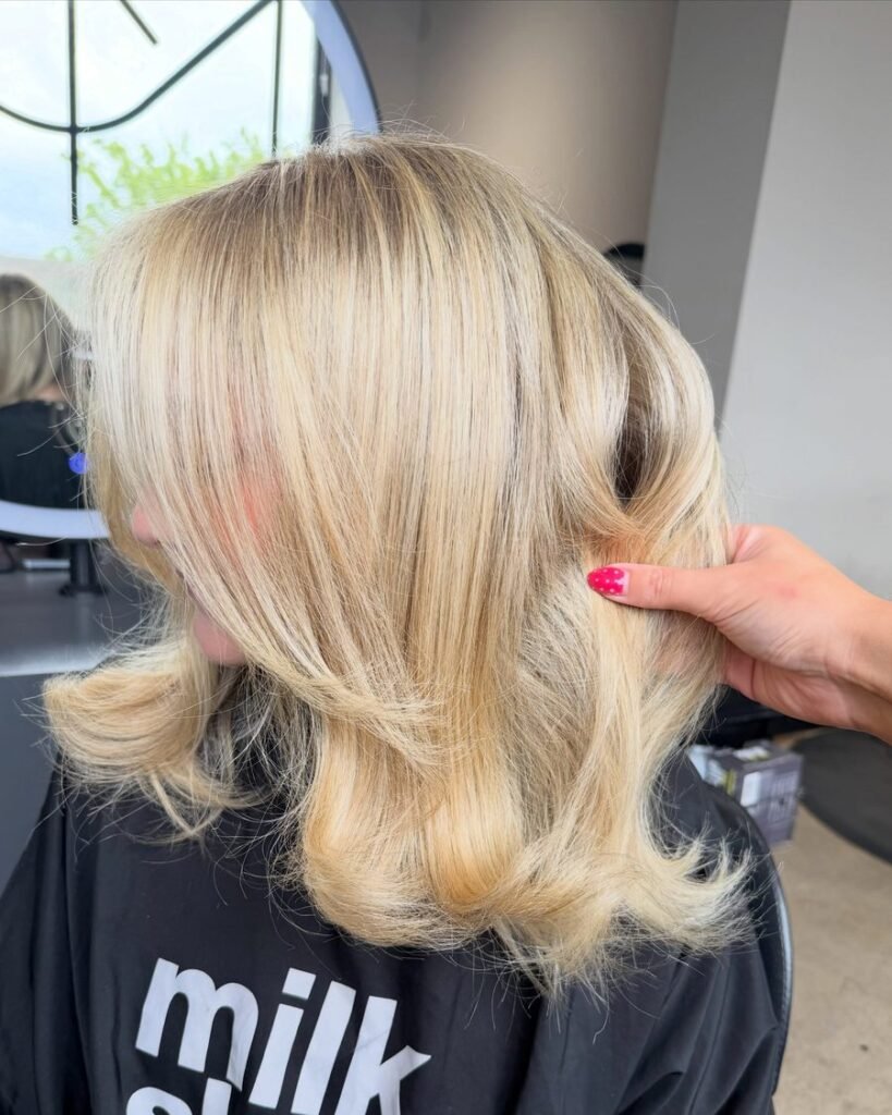 Buttery blonde fall hair color 2026