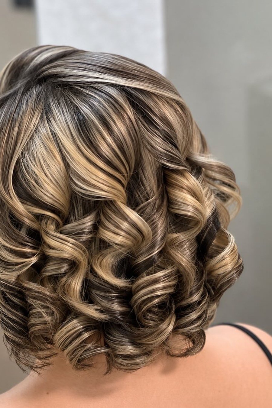 Curly Graduated Bob mom haircut idea