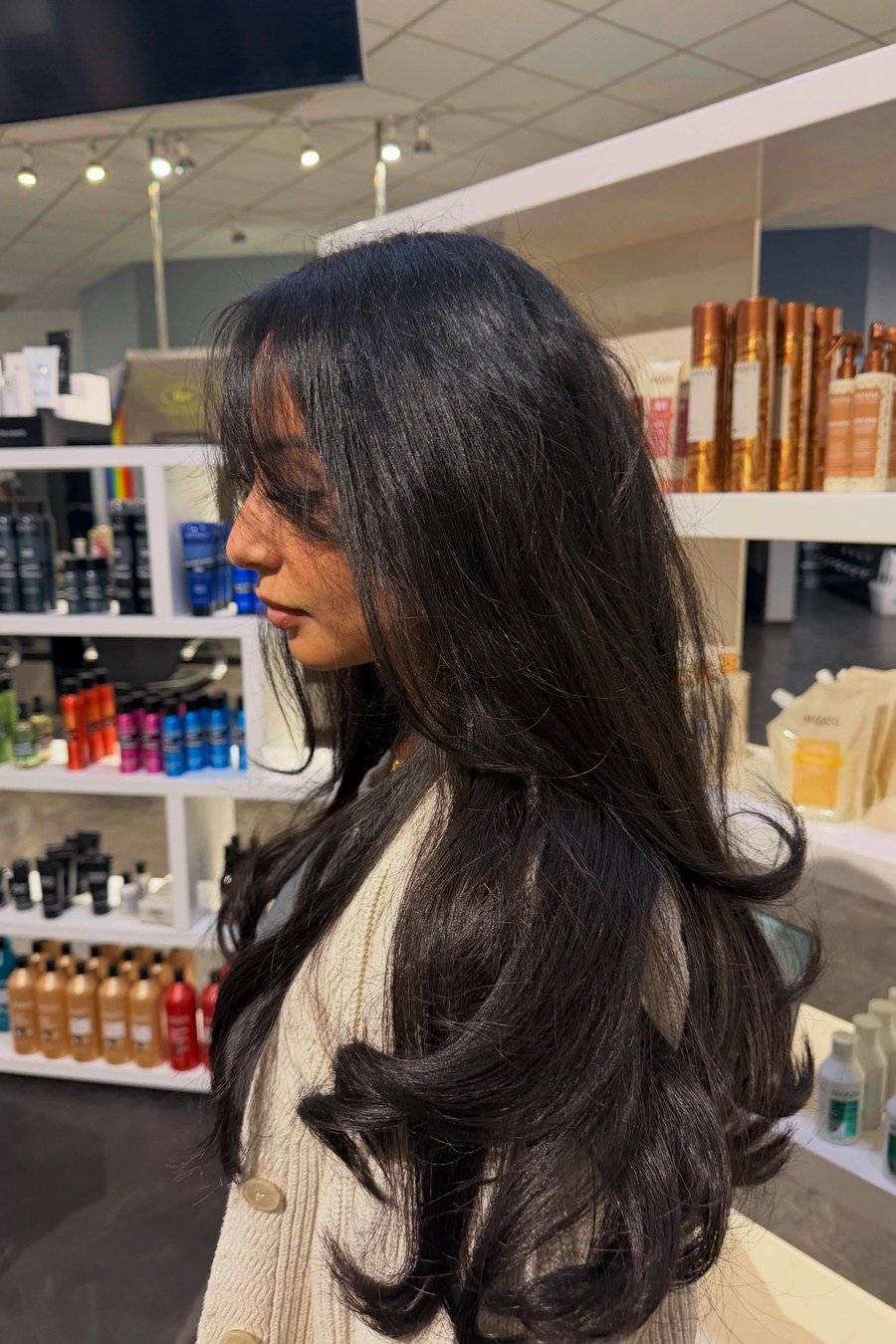 Long Wavy Layers with Curtain Bangs mom haircut idea