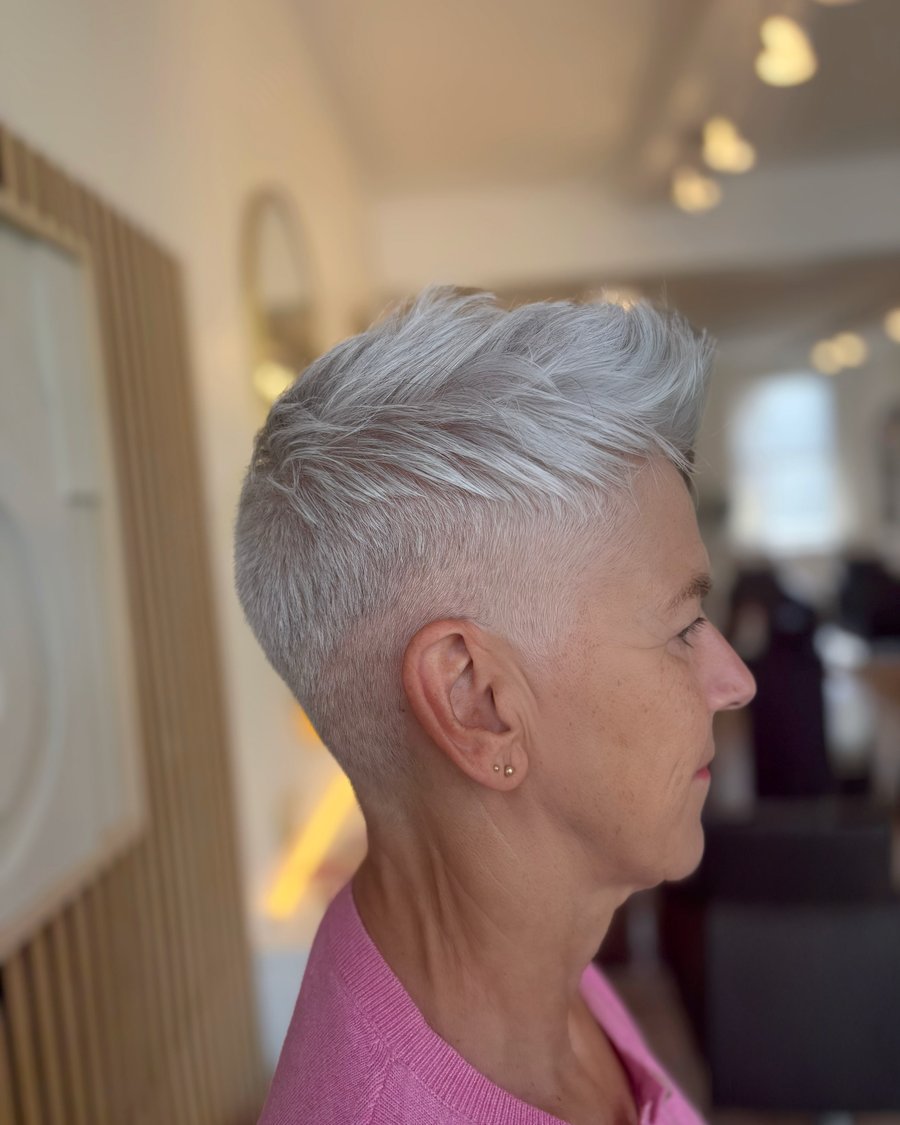 Silver gray long pixie on older woman