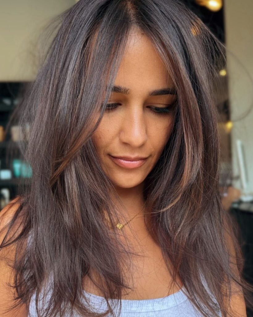 Brunette ribbon highlights - long layered haircut for women over 50