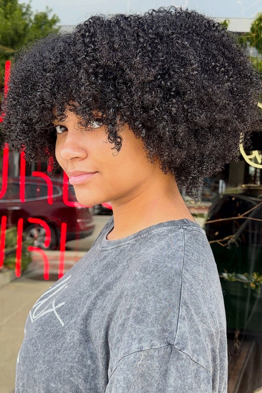 Modern Curly Bowl Cut — edgy short curly haircuts