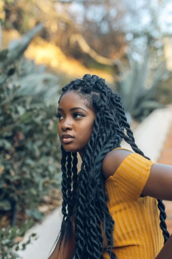 Featured image — striking winter-appropriate portrait of a Black woman with a protective hairstyle, clear hair visibility, warm natural look - winter hairstyles for black women