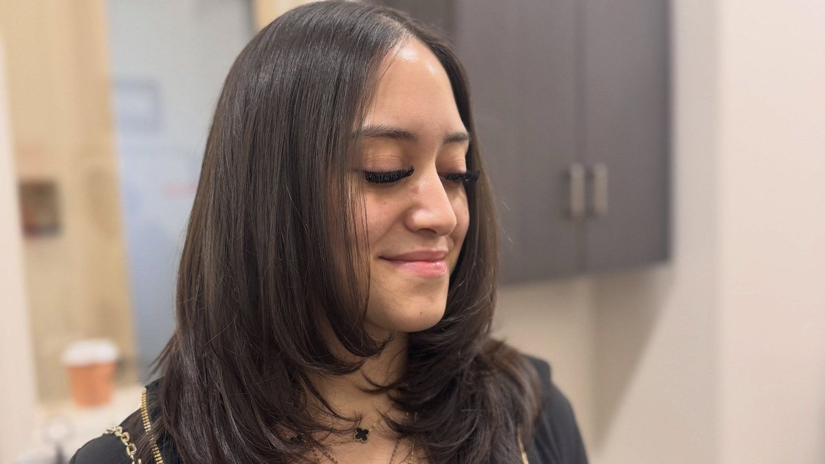 30 Gorgeous Shoulder Length Hairstyles for Women — smiling woman with a fresh layered shoulder length haircut