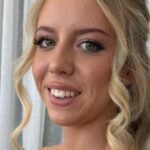 Beautiful half up half down hairstyles on a smiling woman — featured image