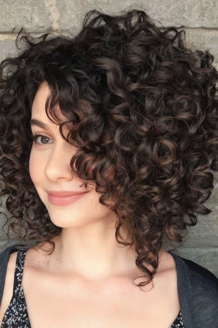 Asymmetrical Curly Bob - layered short curly haircuts