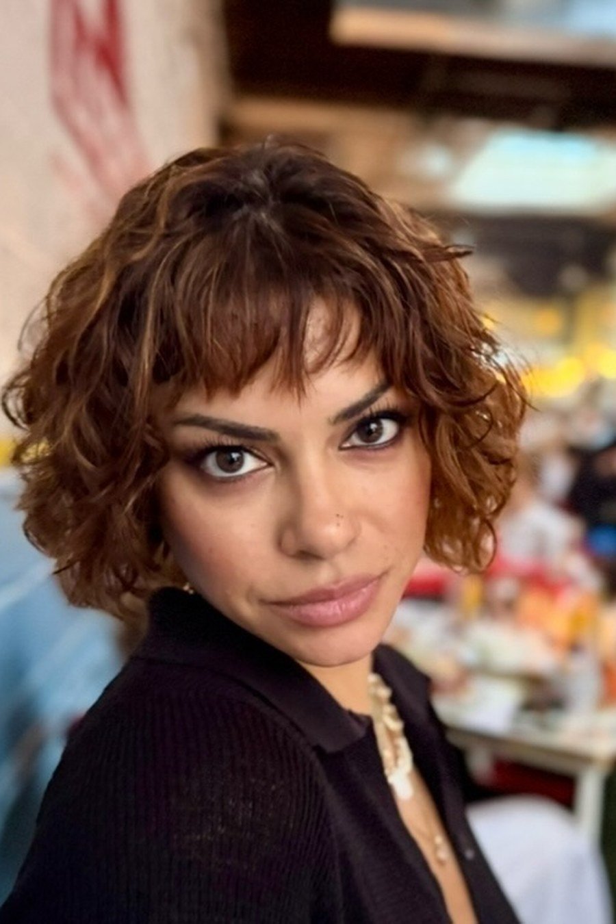 Choppy Curly Bob with Bangs - layered short curly haircuts