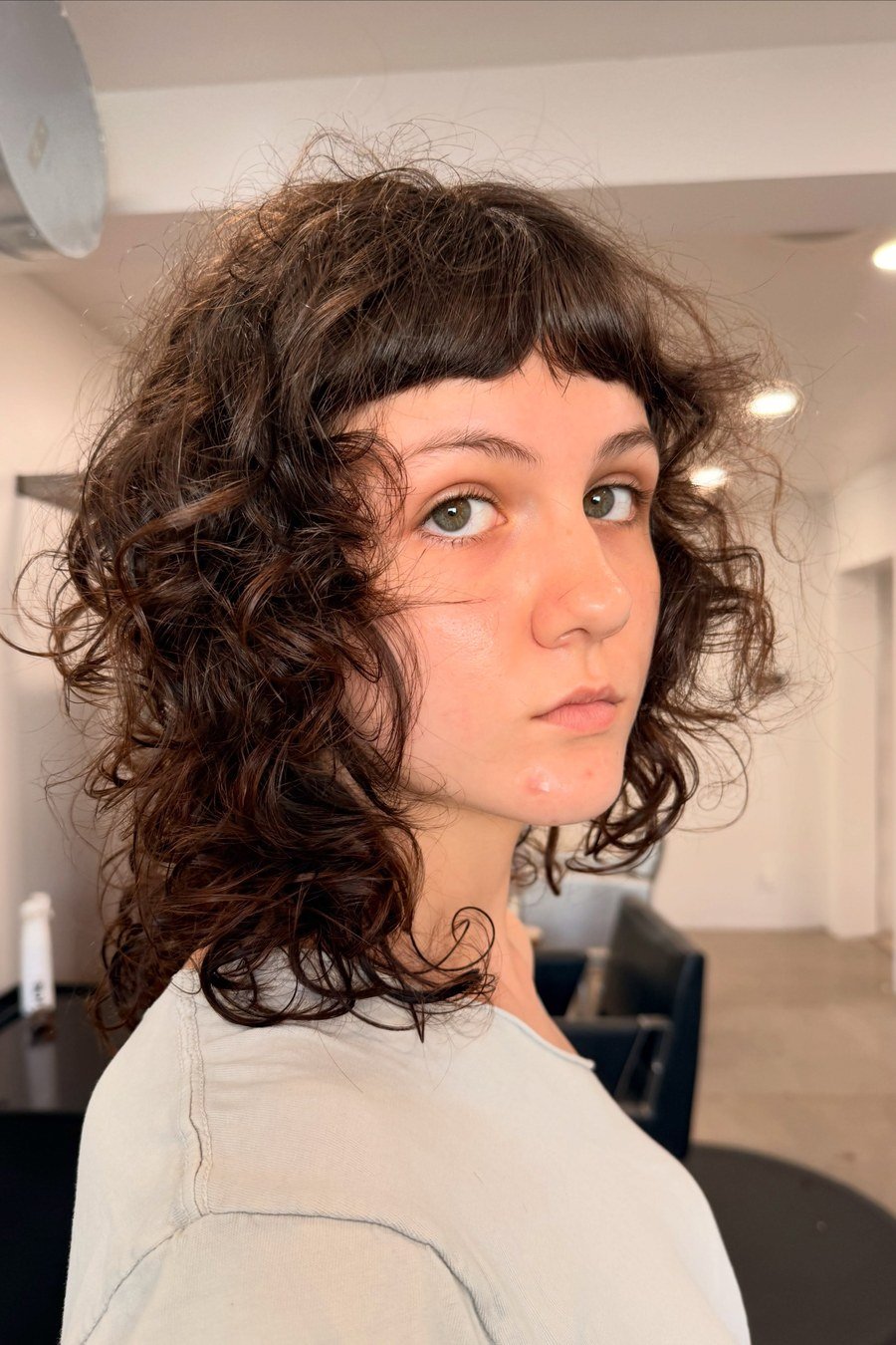 Curly Bowl Cut with Micro Bangs - layered short curly haircuts