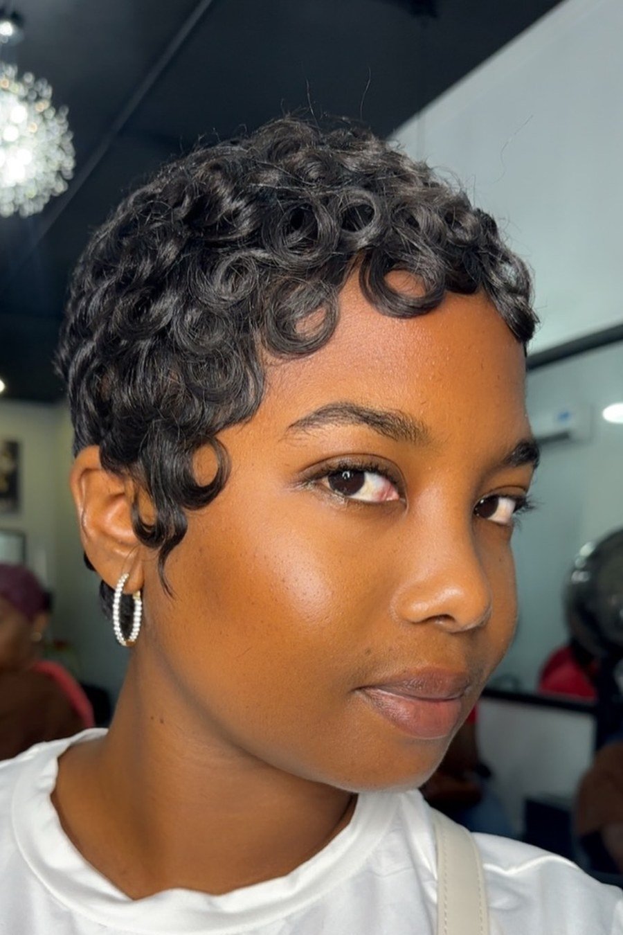 Rounded Curly Pixie - layered short curly haircuts