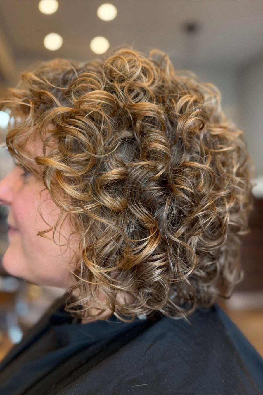 Chin-Length Curly Bob with Soft Layers - layered short curly haircuts