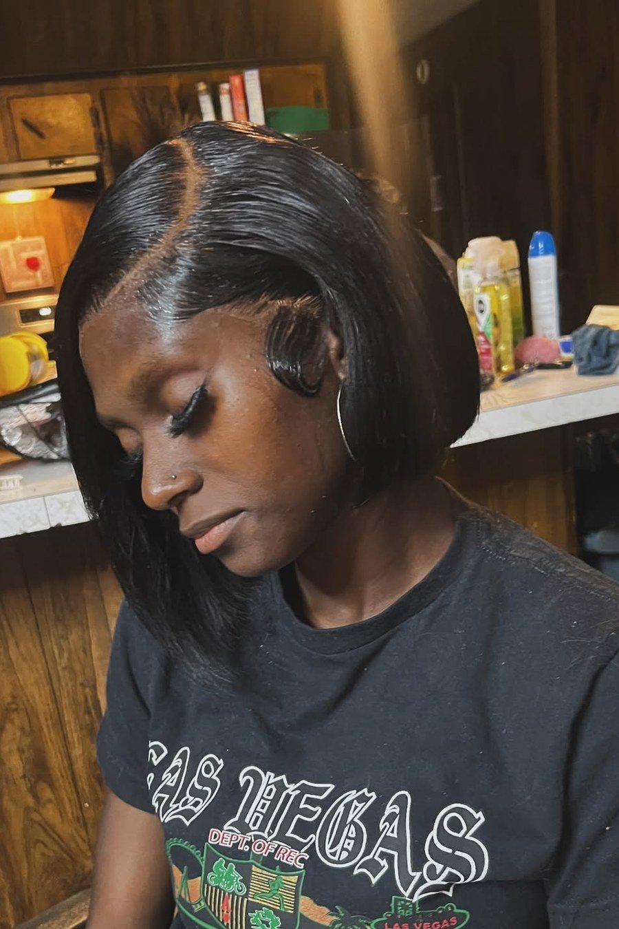 Jet-Black Sleek Bob — low maintenance black woman ear length short bob