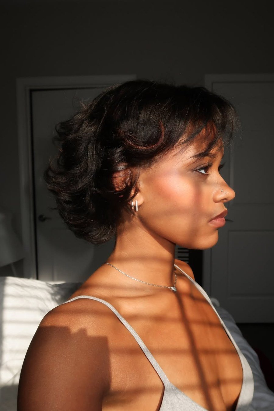 Chin-Grazing Curly Lob — low maintenance black woman ear length short bob