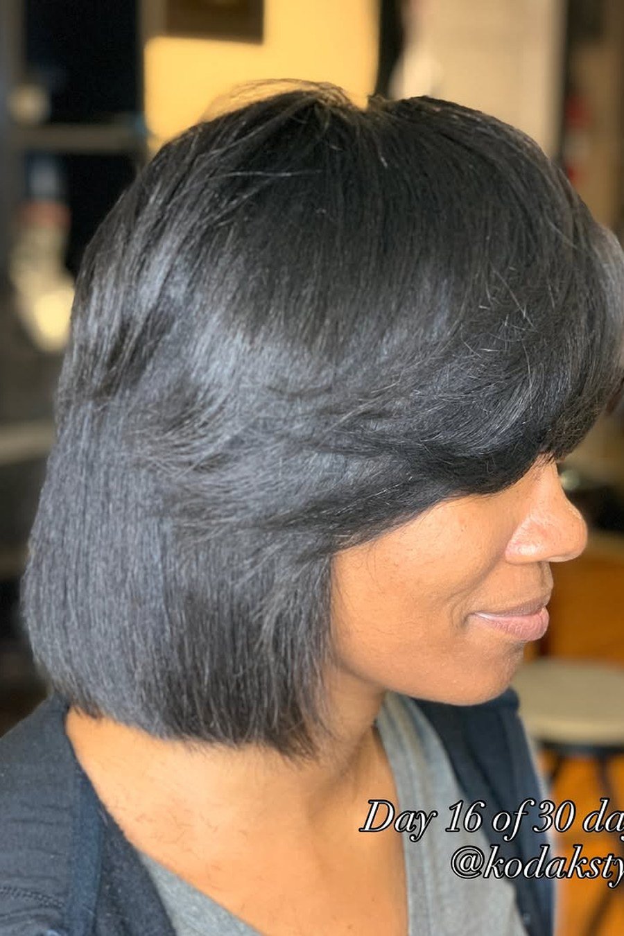 Silk Press with Feathered Ends — low maintenance black woman ear length short bob