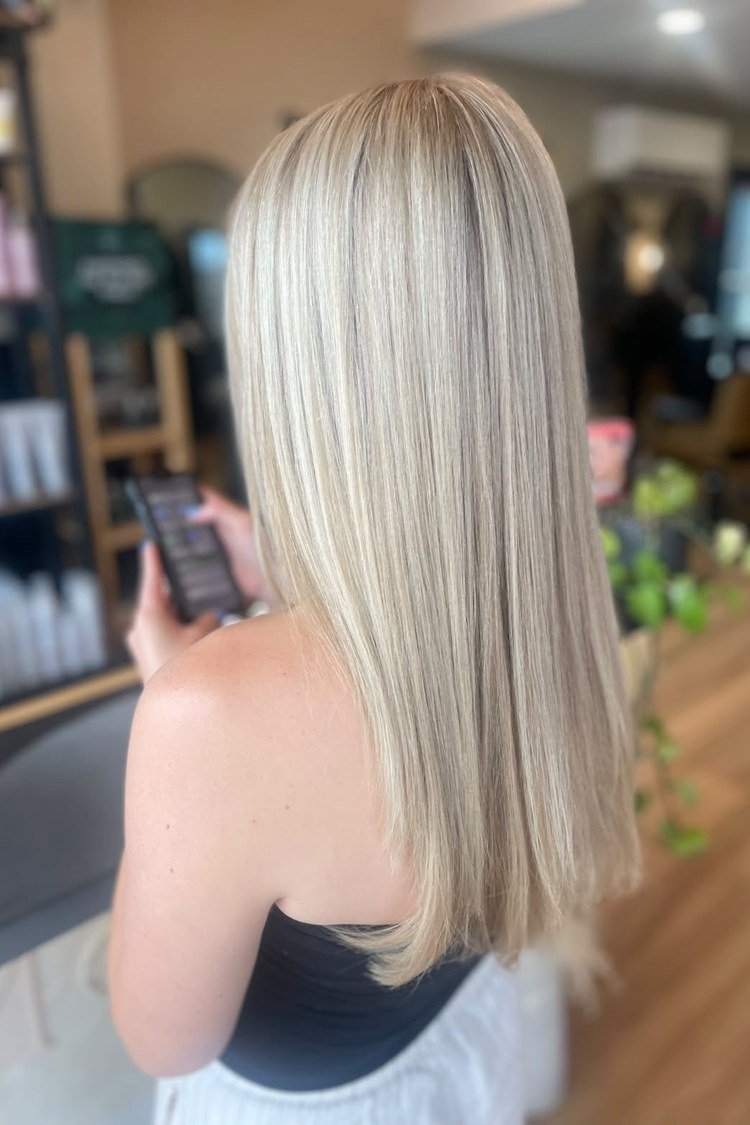 Delicate platinum babylights woven through natural blonde hair