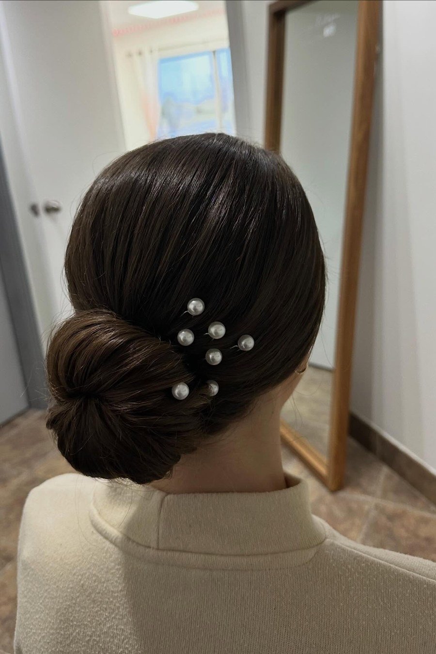 Low Chignon with Pearl Pins — elegant updo hairstyles for women