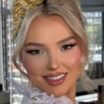 Elegant updo hairstyles on a smiling woman — featured image